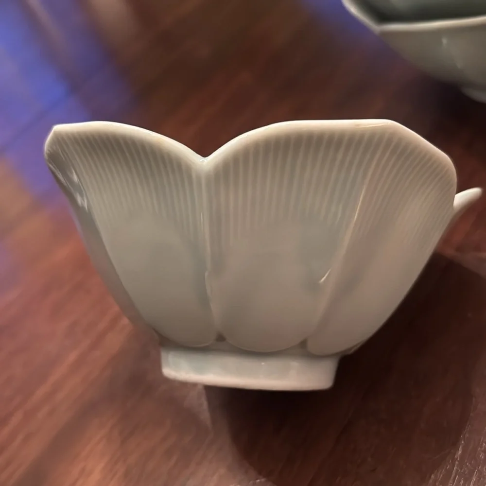 Set of four celadon lotus bowls